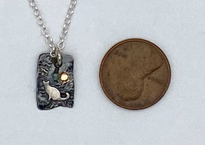 Silver, gold, and pearl cat necklace