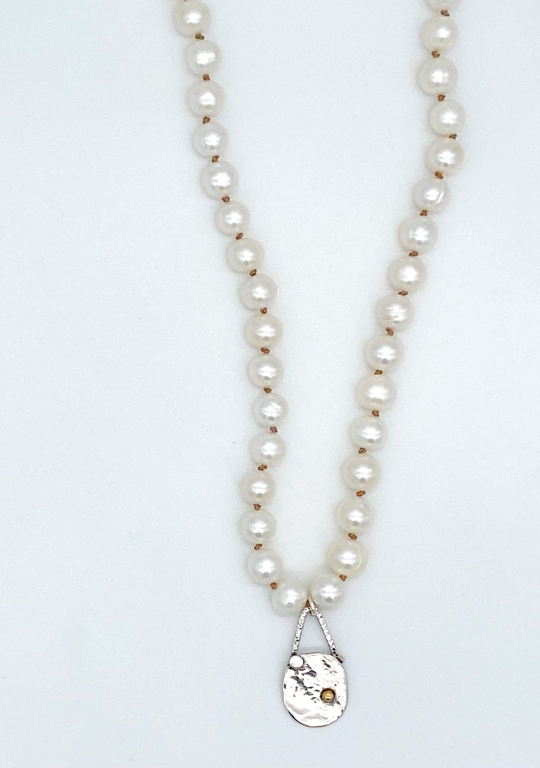 Pearl, silver, and 14 karat gold necklace