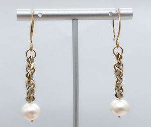 Pearl, gold, and silver earrings