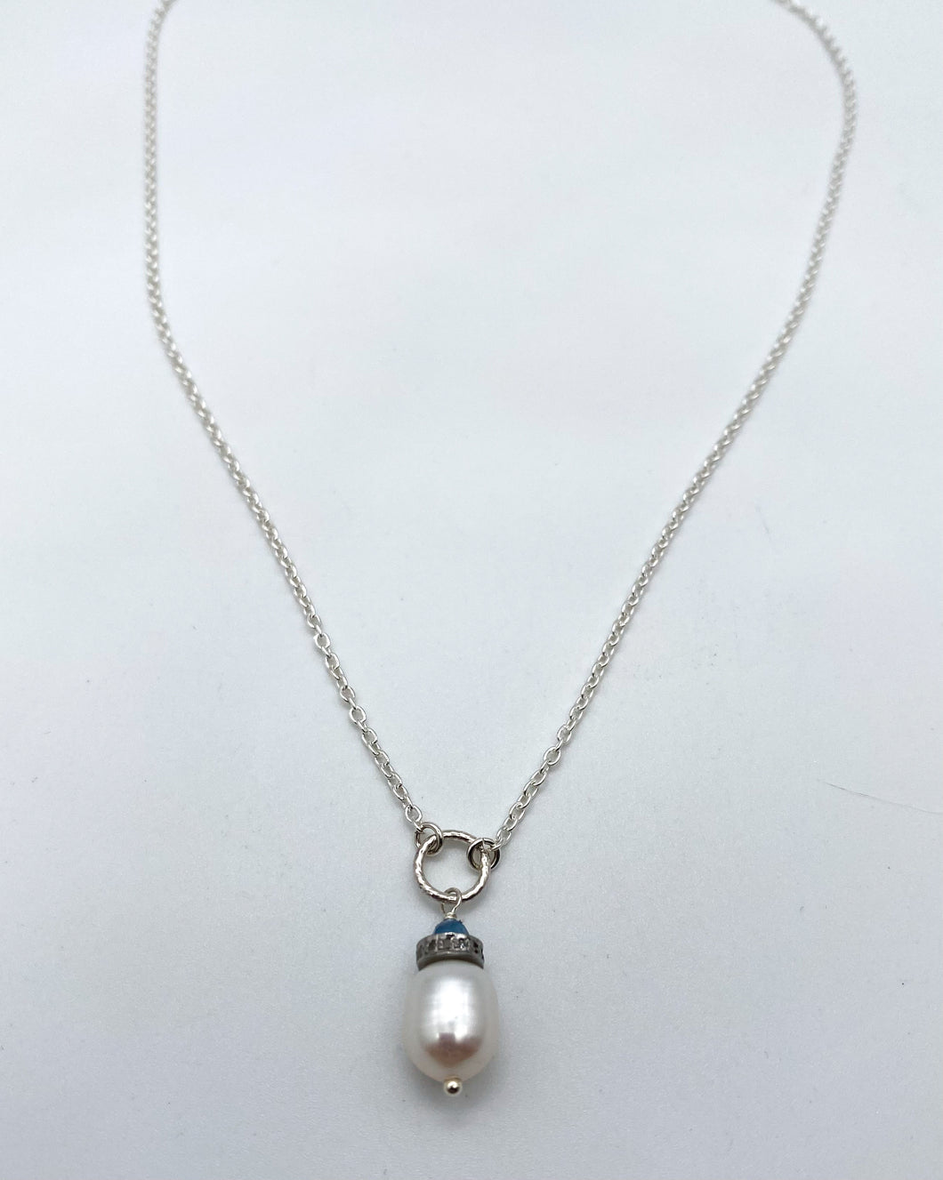 Pearl, pave diamond, and aquamarine necklace